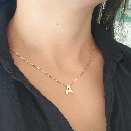 Realistic picture of 14K Gold Diamond Letter Pendant With a Special Brushed Finish 