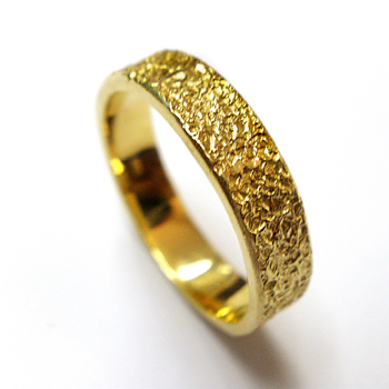 14K gold wedding ring with rugged texture