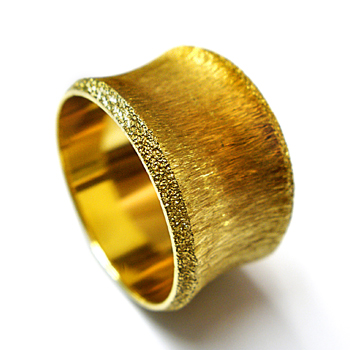 Wide wedding ring with glittering stone finish
